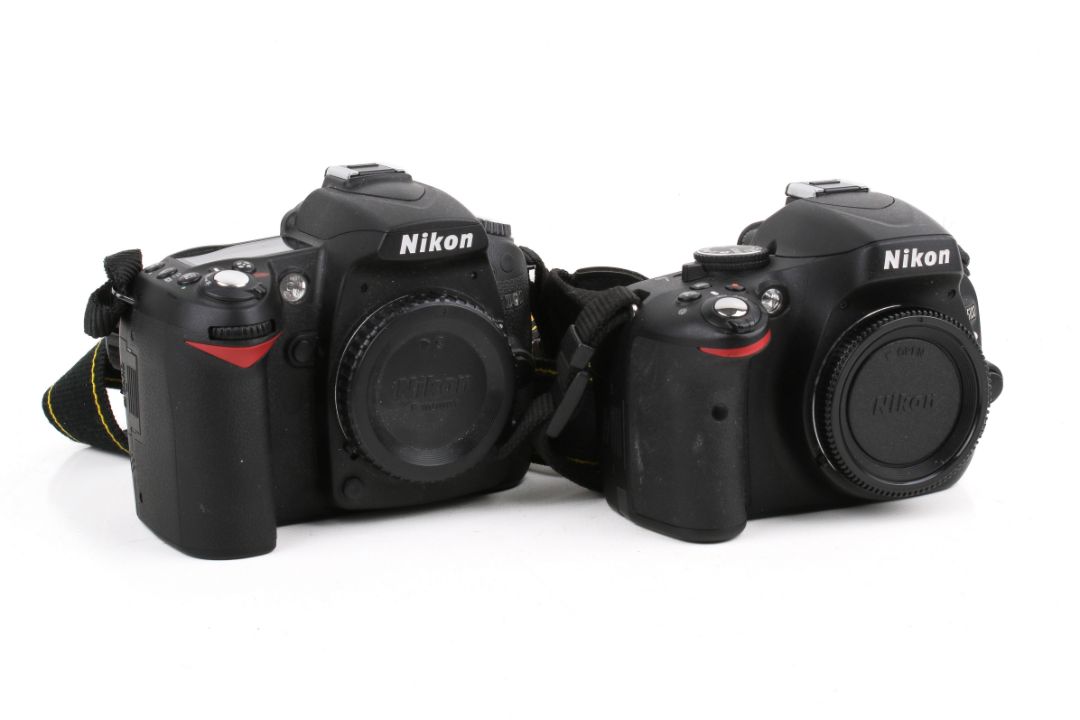 Two Nikon digital SLR camera bodies. - Image 1 of 3