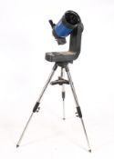 A 'Meade ETX-LS' reflector telescope. D=152.