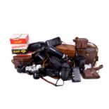 Large box of assorted vintage film cameras and accessories, some boxed or cased.
