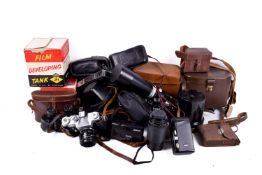 Large box of assorted vintage film cameras and accessories, some boxed or cased.