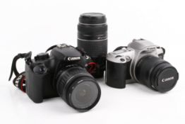 Two Canon SLR cameras and three lenses.
