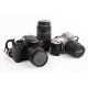Two Canon SLR cameras and three lenses. - Image 1 of 3