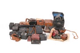 A collection of assorted antique film cameras and photographic accessories.