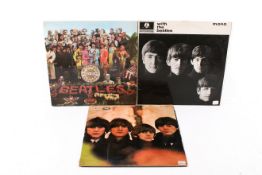 A group of three assorted The Beatles LP vinyl records. Including Sgt.