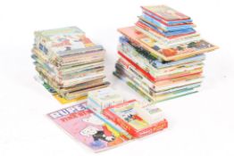 A collection of vintage Rupert Bear books and others.