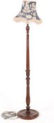 A 20th century mahogany standard lamp.