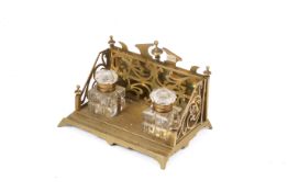 A vintage brass double inkwell stand.