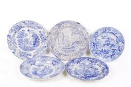 Five 19th century blue and white ceramic dining plates.