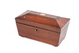 A Georgian mahogany tea caddy.