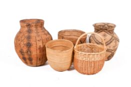 Three assorted ethnic baskets with two others. Including a wicker shopping basket, etc.