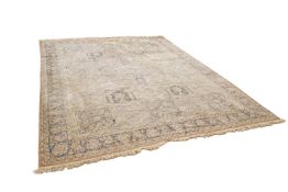 A large vintage wool rug (af). Having multiple borders with a geometric grid pattern.