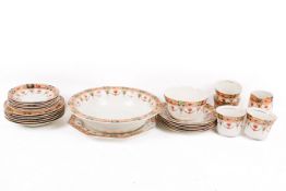 A Devon Imari part tea service. Including six cups and saucers, a sugar bowl, large dish, etc.