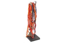 A group of Indian glass bead necklaces. Various colours and lenghs, with four attached bells.