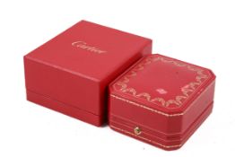 An empty red and gilt Cartier box and card box. Both with a little damage.