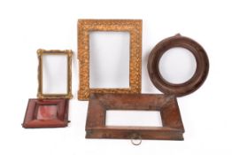 A group of five assorted small picture frames.