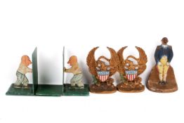 A group of assorted metalware. Including a pair of bookends and a door stop, etc.