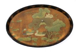 A modern Chinese oval lacquered tray decorated with ducks and lilly pads.