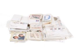 A collection of assorted first day covers and stamp related postcards.