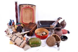 A box of assorted folk art collectables. Including bead work and treen items, etc.