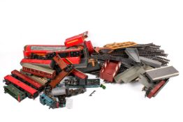 An assortment of Hornby 00 gauge locomotives, carriages, rolling stock and layout accessories.