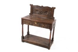 A 19th Century carved oak side or hall table.