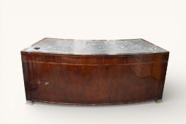 A late 20th century curved desk with inset leather top.