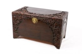 Heavily carved 20th Century Chinese camphor wood lined trunk. Carving depicting birds in foliage.