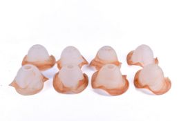 A set of eight frosted glass lamp shades. Having butter scotch wavy edge.