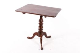 A 20th century mahogany tilt top table.