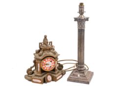 A cast metal lamp base and an 8-day mantle clock.