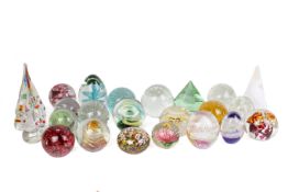 A collection of large glass paperweights.