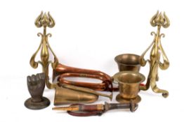 An assortment of metalware. Including bronze mortars, a pair of brass fire dogs, copper horn, etc.
