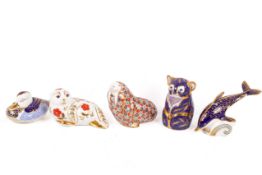 Five Royal Crown Derby porcelain figures.