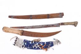 Two late 19th/early 20th century knives with decorative scabbards.