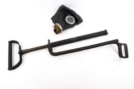 A Russian gas mask and a WWII Home Guard stirrup pump.