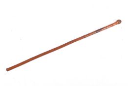 A Japanese carved smoked bamboo walking cane.