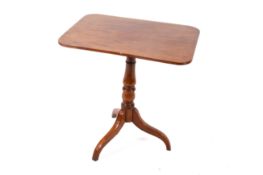 A Victorian mahogany tilt-top table.