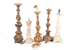 Five large wooden and resin lamp bases.