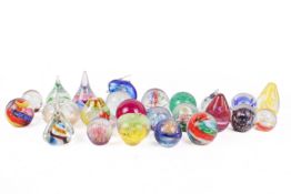 A large collection of glass paperweights.