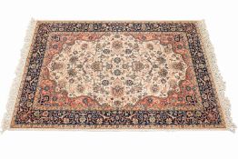 A Persian style wool rug on cream ground. Having multiple borders and floral motifs.