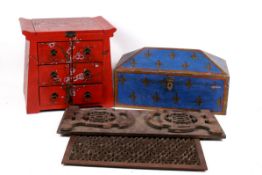 Two vintage wooden boxes, a carved panel and a folding bookshelf.