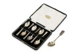 A box of silver coffee spoons and a further spoon.