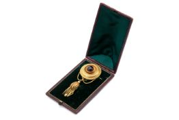 A late Victorian Etruscan revival brooch in a fitted case.