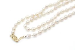 A necklet of cultured freshwater pearls of banded and pitted form. Overall length circa 1000mm.