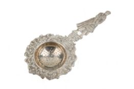 A silver tea strainer.