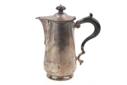 An early 20th century small silver coffee pot.