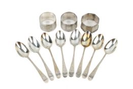 A set of eight Scottish silver spoons and three napkin rings.