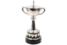 A large silver twin-handled, lidded trophy cup, 'The Weeks Perpetual Silver Challenge' cup.