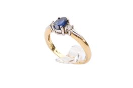 An 18ct gold, sapphire and diamond ring.