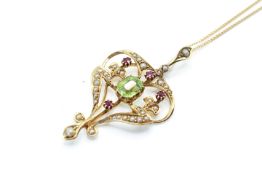 A yellow metal, pearl and stone set pendant.